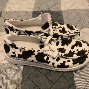 Cow printed boat shoes
